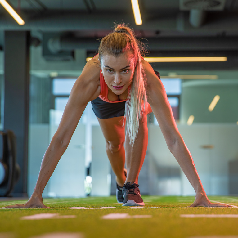 Sportswoman Preparing for Marathon in Gym